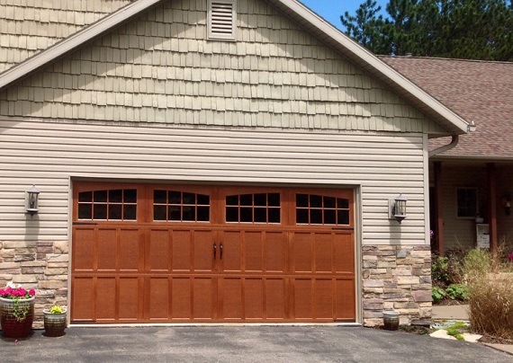 Wood carriage-style garage doors on a home
